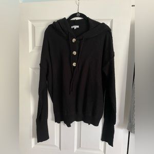 Ladies, black, white Burch sweater fabric hoodie w reverse stitching buttons.